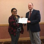 Surendra Singh receiving award certificate at the American Society of Agronomy, Southern Branch meeting in Jacksonville, FL