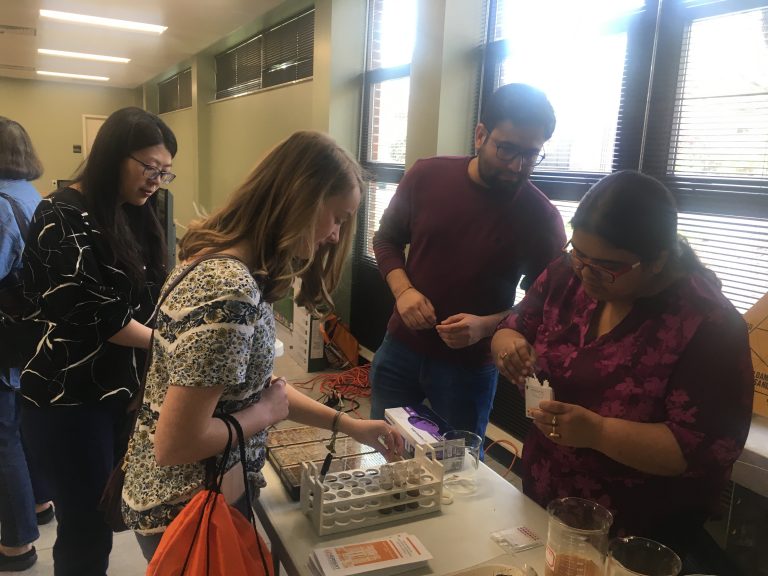 Students examining samples at the 2nd Annual Research Day event in March 2019.