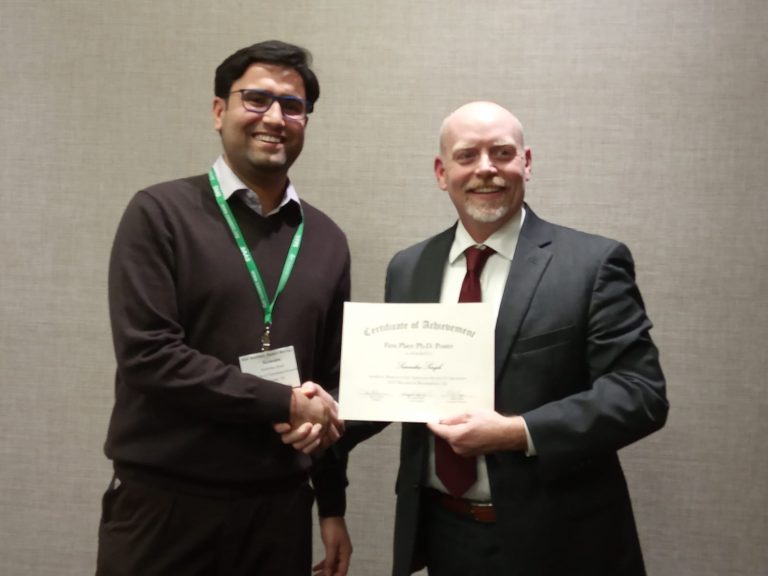 PhD student Surendra Singh receiving award for the poster competition category at the American Society of Agronomy in 2019.