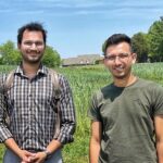 A photo of Dr. Neelipally (left), and Dr. Chhetri (right) in the farm.