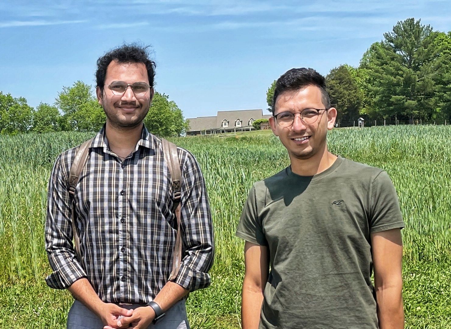 A photo of Dr. Neelipally (left), and Dr. Chhetri (right) in the farm.