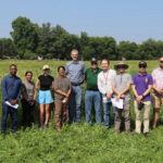 The photo features a group photo of Soil Management Lab members with the NC1178 Multi-State Project Team.