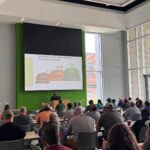 This photo features Dr. Neelipally presenting to the audience regarding the evolution of soil health understanding at the Green Industry Field Day 2025.