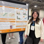 A photo of Amber Gunter in front of her poster at the CANVAS 25 conference