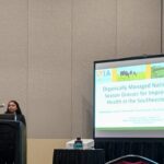 A photo of Binsiya Kallingal presenting at the CANVAS 25 conference